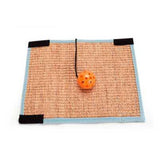 Cat scratching pad near sofa